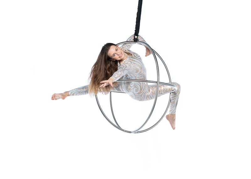 fadca youth troupe member posing in an aerial sphere